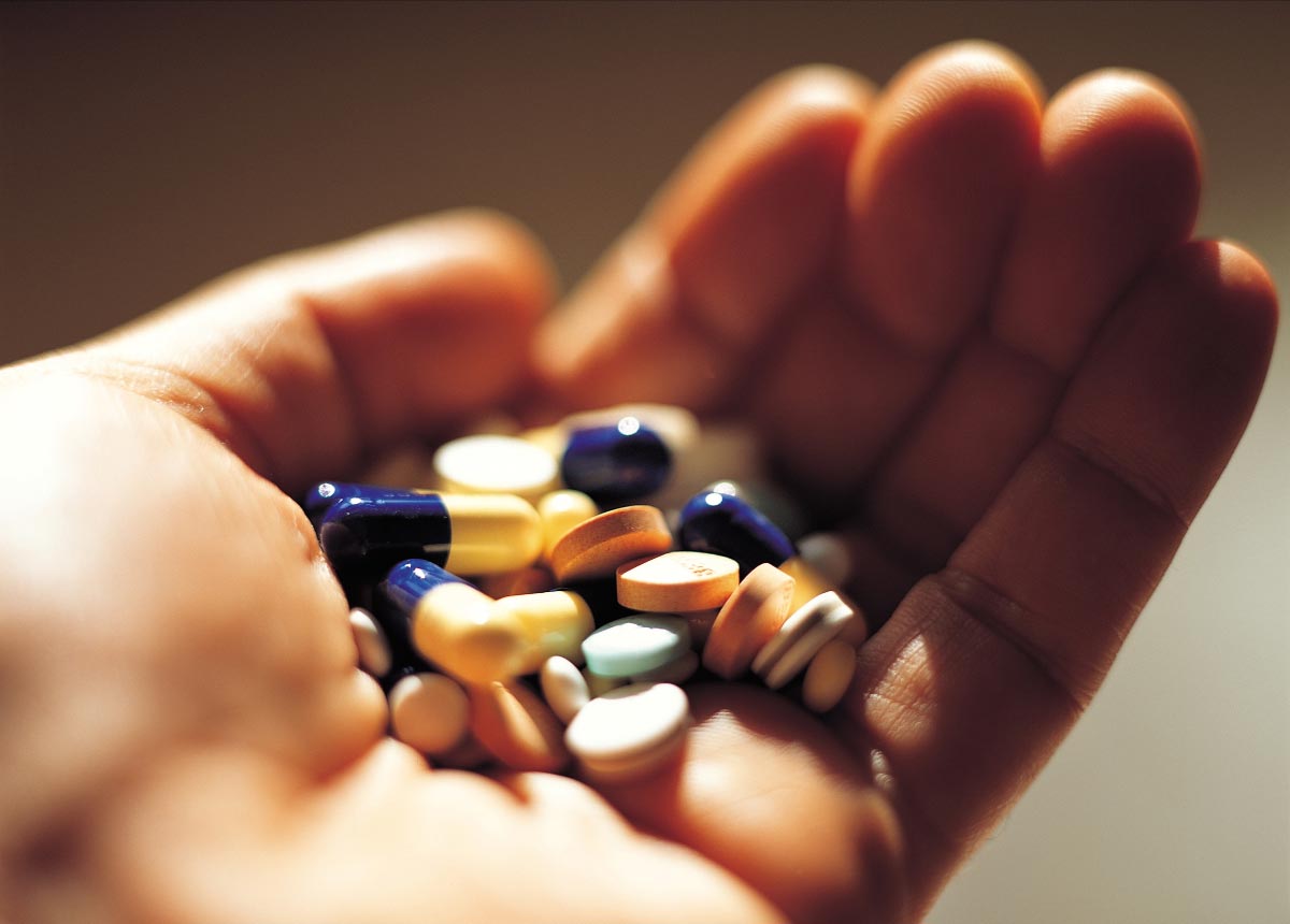Hand-Holding-Medication-Prescription-Pills-Capsules
